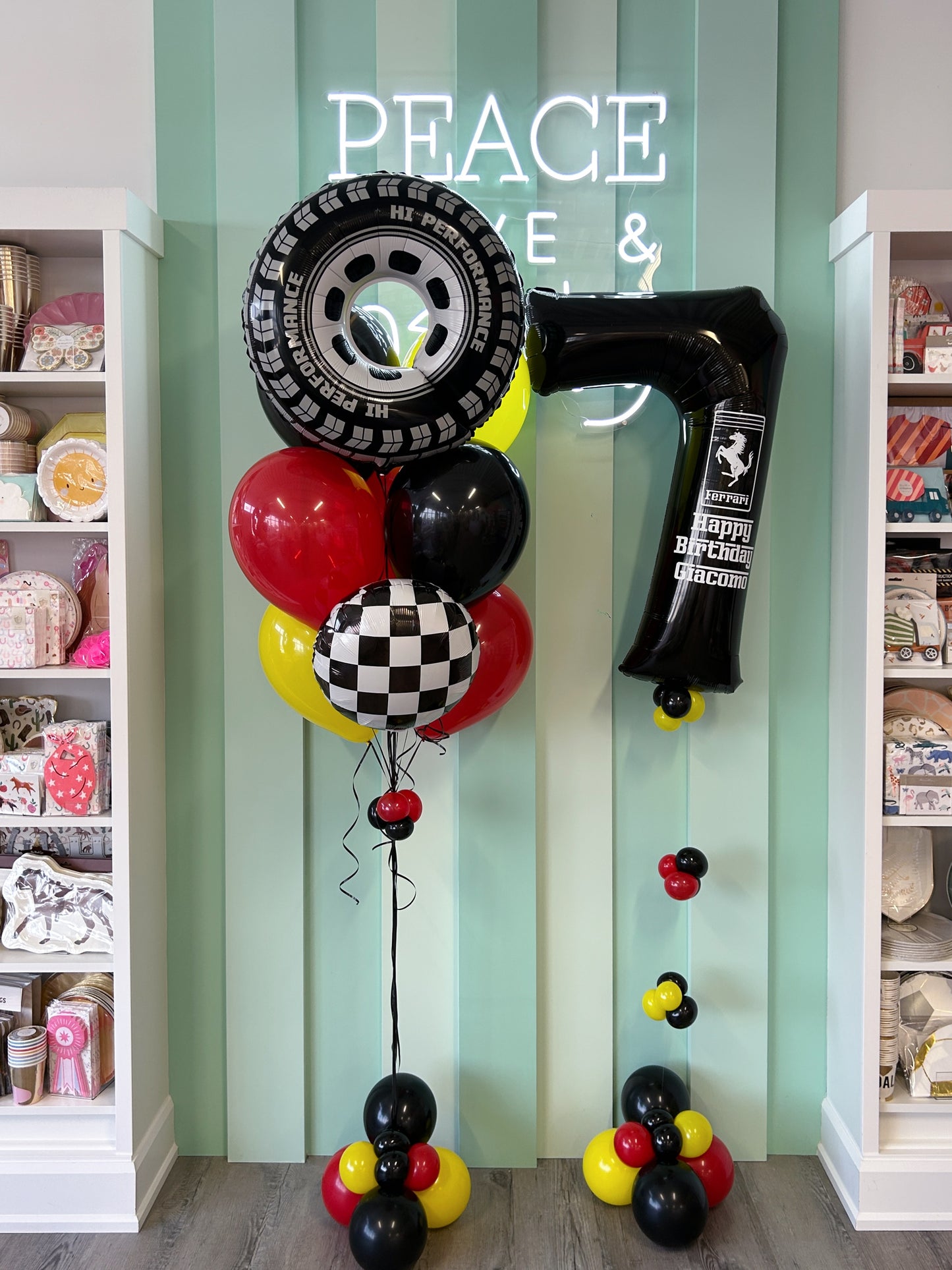 Race Day Mini Kid Pop balloon display with racing tire foil and black number balloon, available in Toronto from Confetti My Party