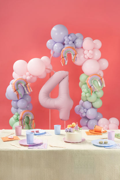 Rainbow foil balloon with fringe styled in a balloon garland with matching party decor - sold in Toronto at Confetti My Party.