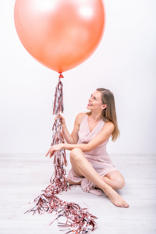 rose gold balloon tassel and model posing 