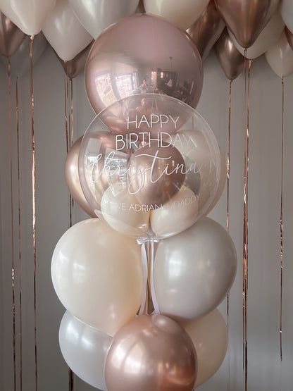 Rose gold and cream personalized birthday balloon package with clear stuffed bubble balloon in Toronto.
