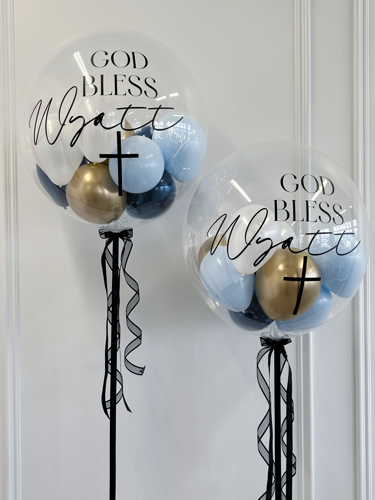 Personalized sacrament bubble balloons with blue, gold and white balloons available at our Toronto party shop