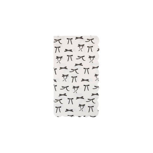 pack of 24 white scalloped dinner napkins with black scattered bow designs. Sold at Confetti my party and fast shipping Canada wide.