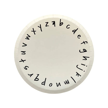 White paper plate with black lowercase alphabet around the rim, ideal for back-to-school parties in Toronto.