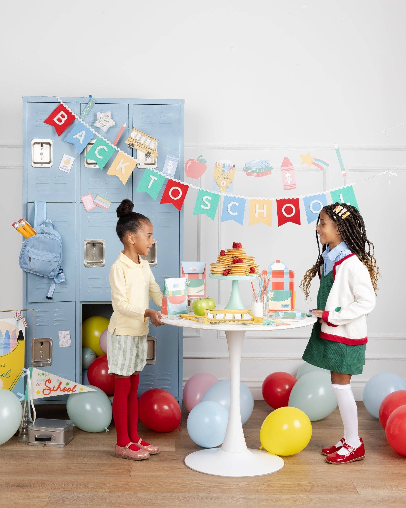 School icons banner styled with colourful back to school party supplies available at our Toronto party shop.