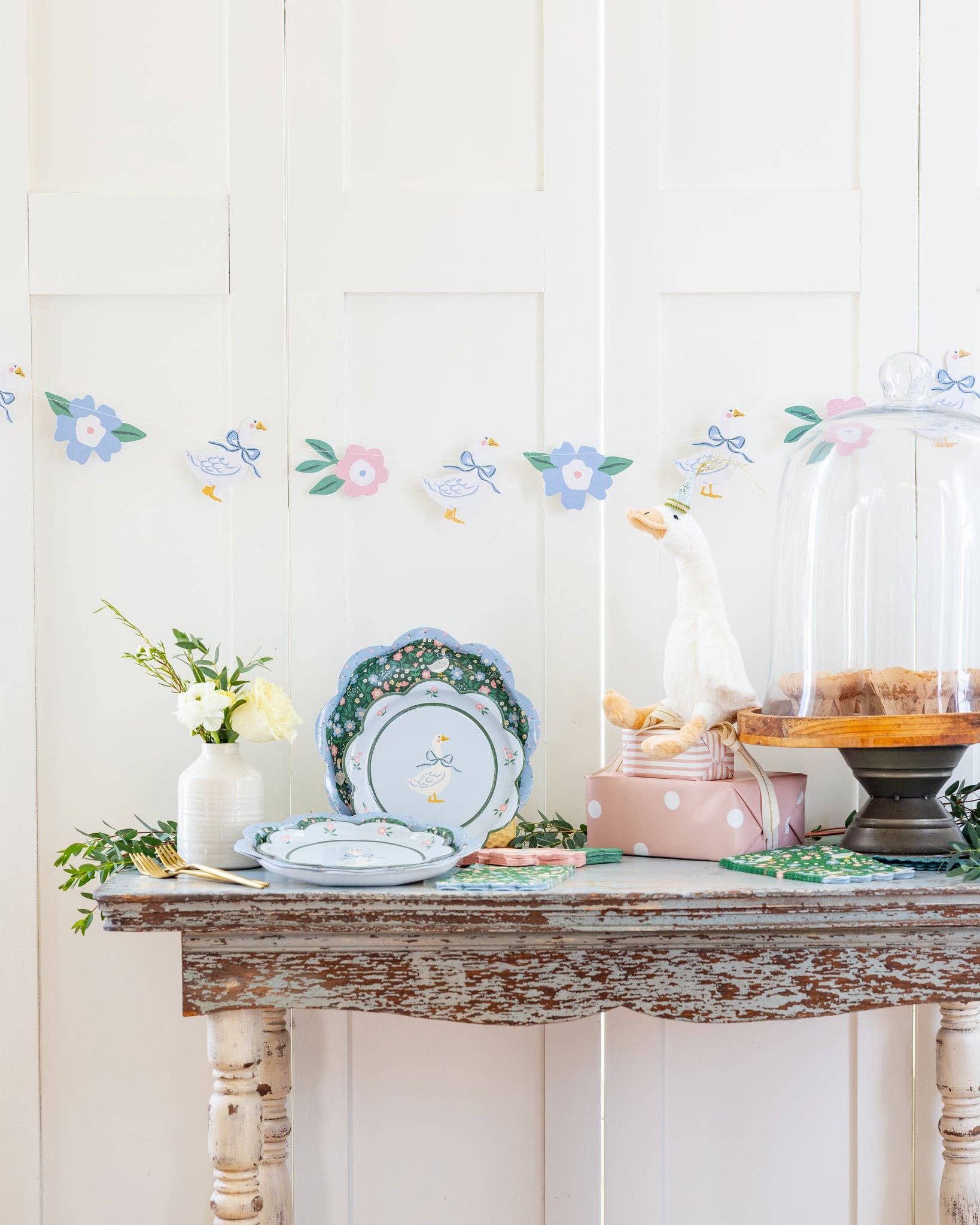 Silly goose scalloped dinner plates styled for an Easter table with pastel decor, sold in Toronto at Confetti My Party
