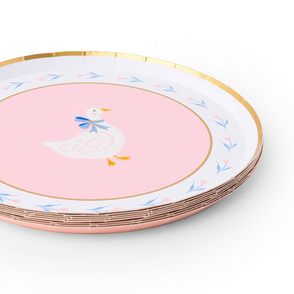 Stack of pink goose paper plates with gold foil rim and floral accents, available in Toronto and shipping across Canada