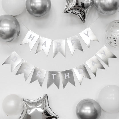 Silver 'Happy Birthday' banner with balloons on a white background