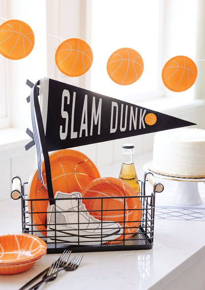 Slam Dunk basketball felt pennant styled with orange basketball party plates and basketball garland.