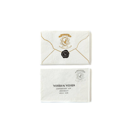 Spellbound envelope-shaped napkins with gold foil wizard crest and black wax seal design