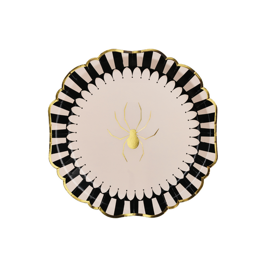 Round paper plate with black and white striped border, scalloped gold edge, and shiny gold spider in the center.