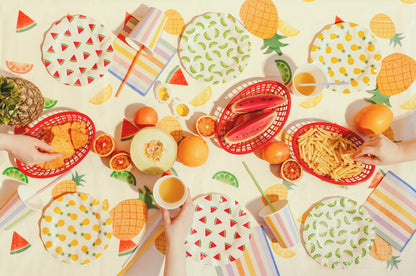 Summer party setup featuring fruit print tablecover with colourful coordinating tableware available at our Toronto party shop