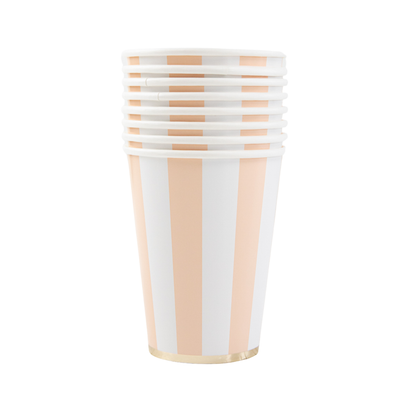 Set of striped paper cups with peach and white pattern on a white background
