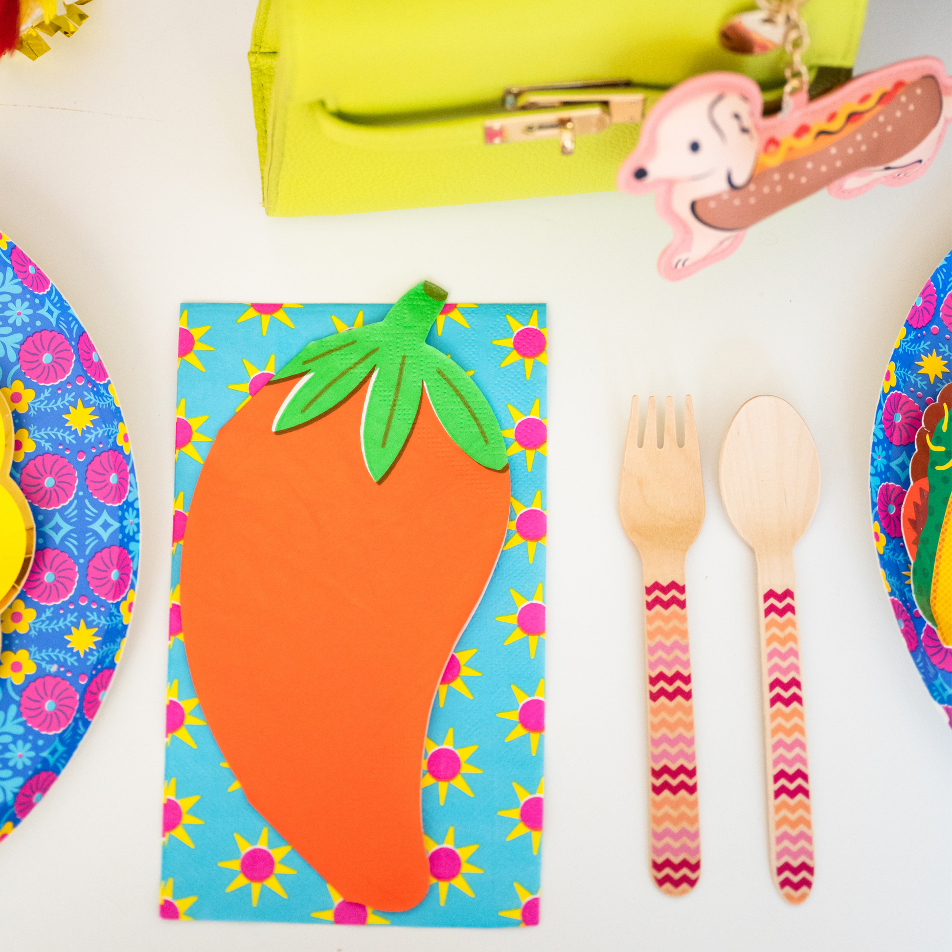 Bright fiesta party table with pepper-shaped napkins, colourful plates, and decorative details, perfect for themed celebrations, available at our Toronto party shop.