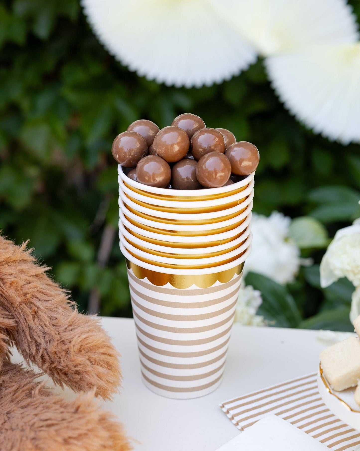 Neutral striped paper cup with gold scalloped trim, ideal for baby showers or birthdays in Toronto.