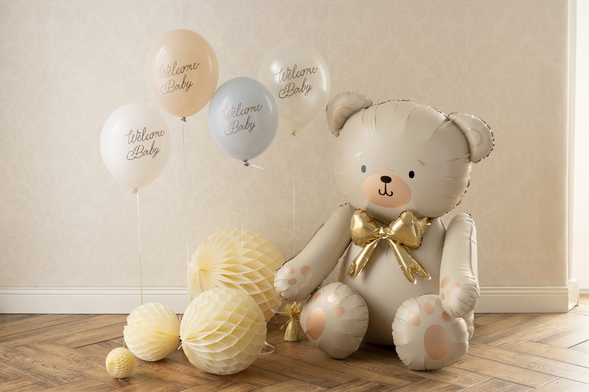 Teddy bear foil balloon with gold bow styled with ‘Welcome Baby’ balloons, ideal for Toronto baby shower decor.