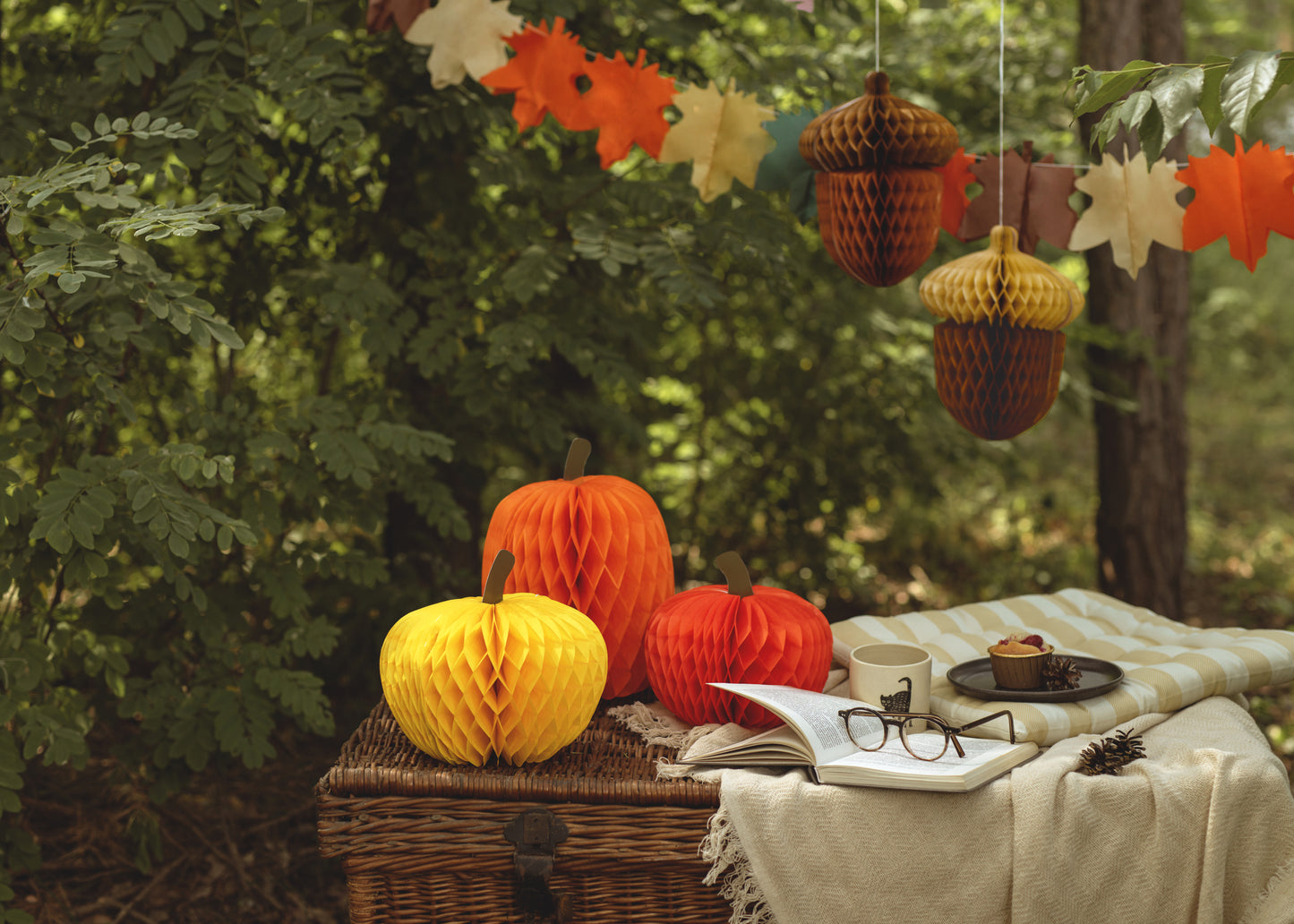 Tissue paper pumpkins in yellow and orange displayed as cozy fall party décor, shipping across Canada.