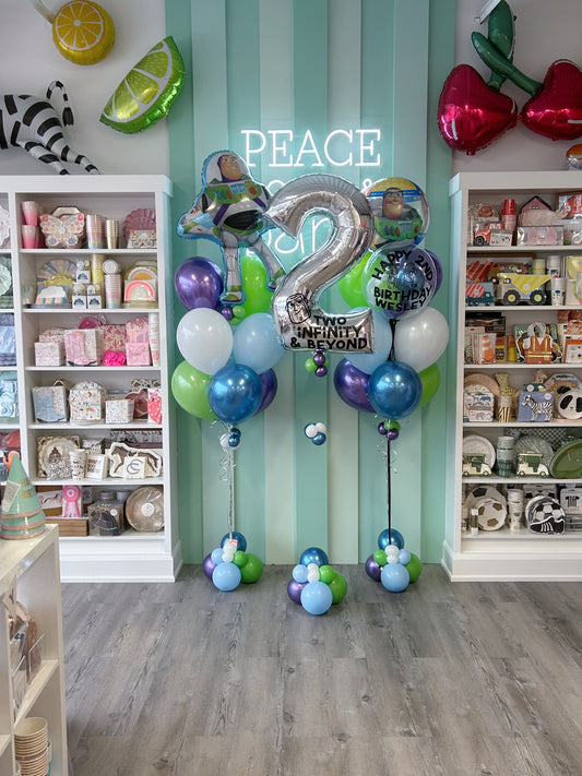 Toy Story balloon bundle with Buzz Lightyear balloons and custom silver number balloon available at our Toronto party shop
