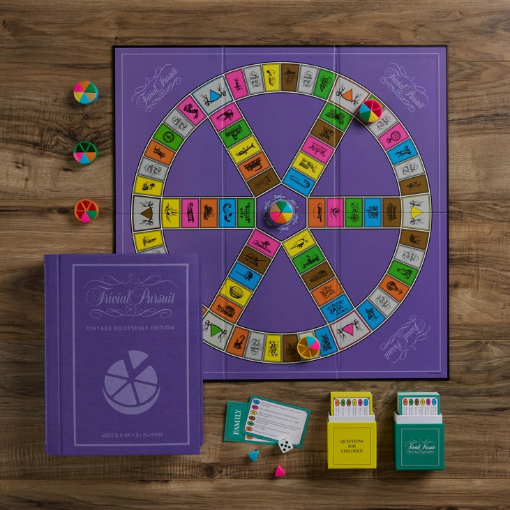 Trivial Pursuit board, pie movers, cards and wedges from the bookshelf edition, shipping across Canada