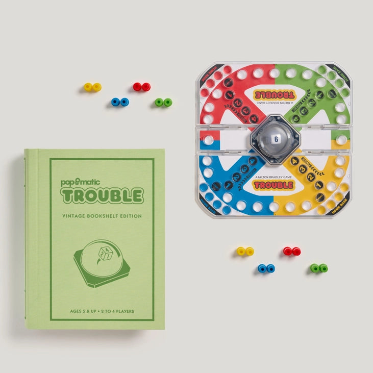 Trouble Vintage Bookshelf Edition game board with Pop-O-Matic die roller and colourful pegs, ready for game nights. Sold in Toronto at Confetti My Party. Ships Canada-wide.