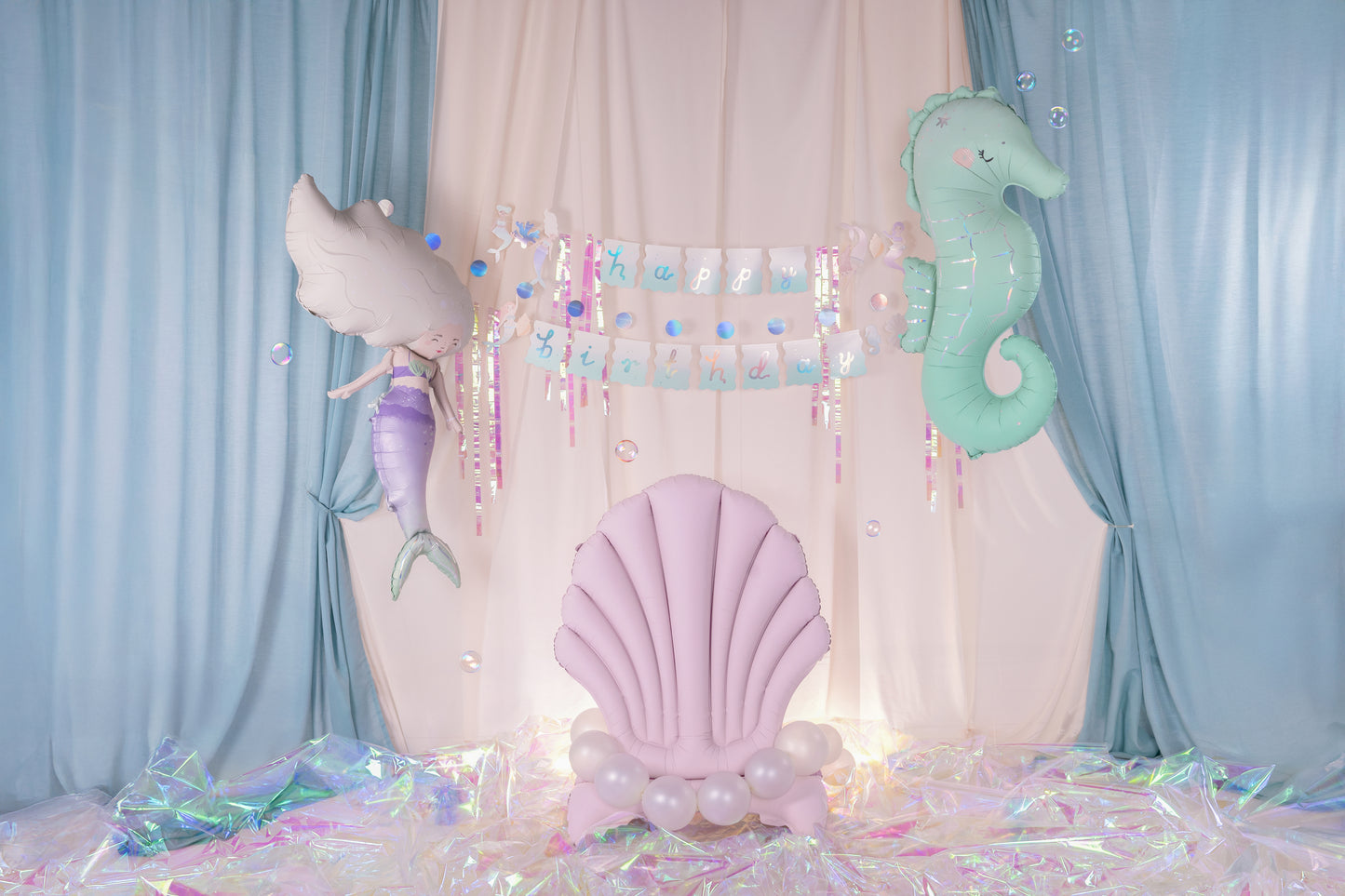 seahorse and mermaid foil balloon set up with matching under the sea party supplies sold in Toronto at Confetti My Party. 