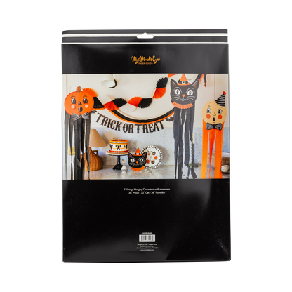 Halloween-themed product packaging with decorative items on a white background