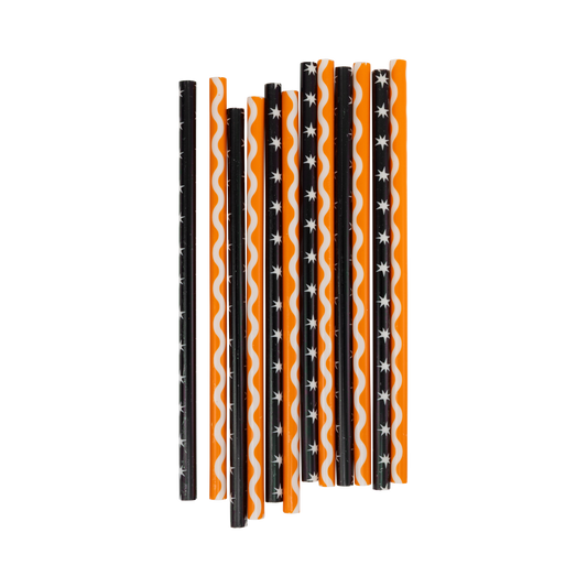Set of Halloween-themed straws with black, orange, and white patterns on a white background