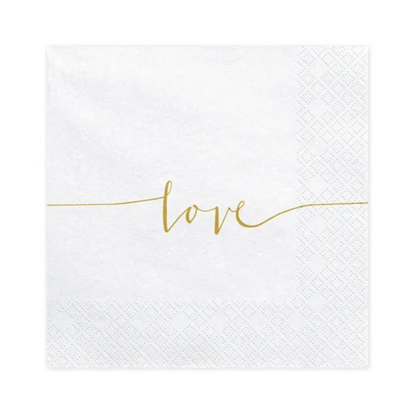 white napkins with love in gold cursive writing