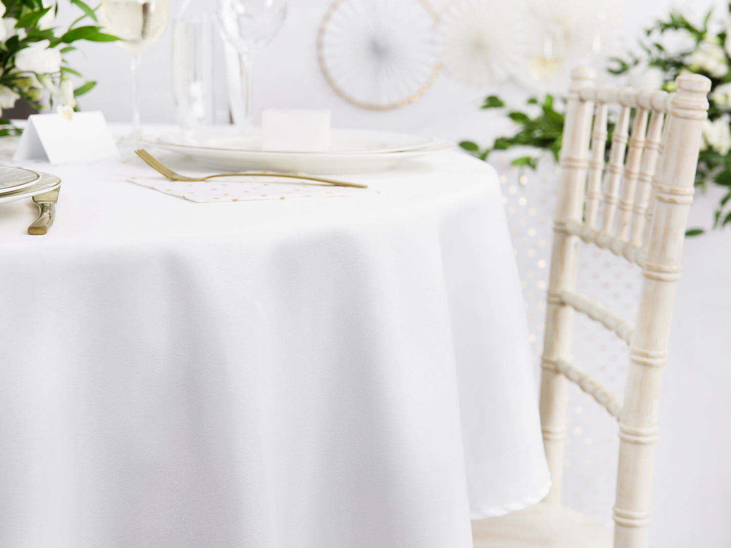 white round linen table cloth on a table 