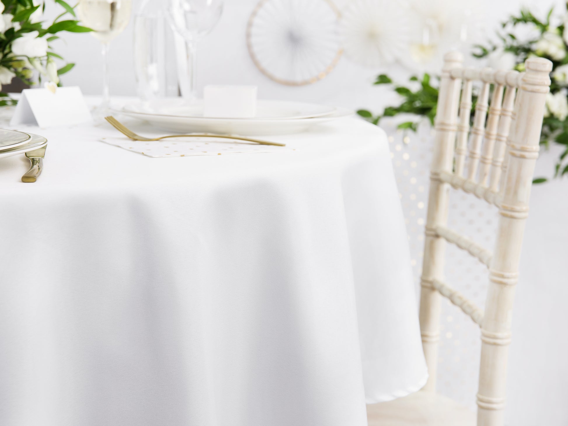 white round linen table cloth on a table 