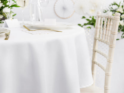 white round linen table cloth on a table 