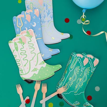 Western-themed party table with Yeehaw large cowboy boot plates in assorted colours, styled with wooden forks, confetti, and balloons, available in Toronto with Canada-wide shipping.