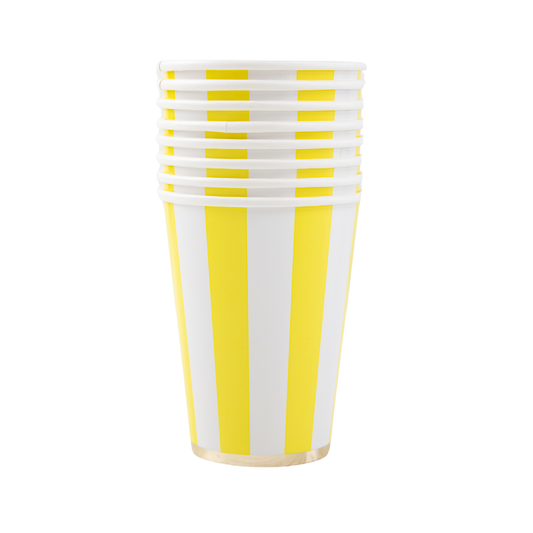 Set of yellow and white striped paper cups on a white background