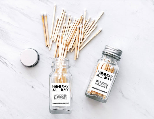 wooden matches with white tip in mini glass bottle