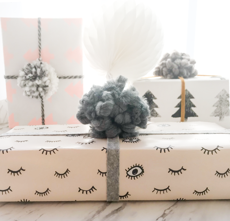 presents wrapped in blush eyes gift wrap sheets