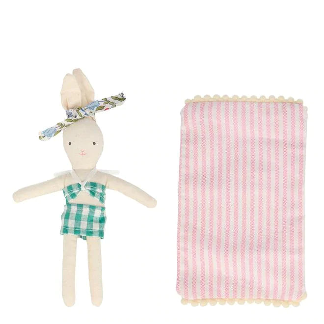 mini bunny with bathing suit with striped blanket