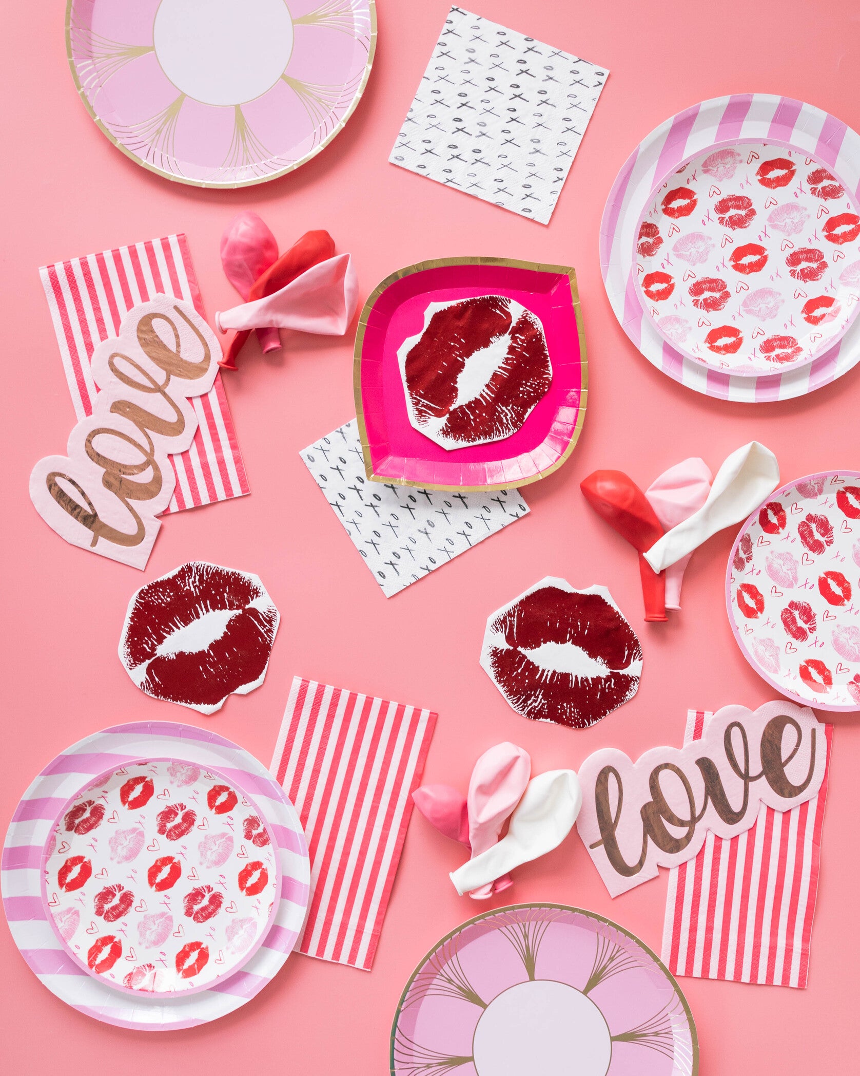 valentines setup - lips napkins, love napkins and pink and white striped plate
