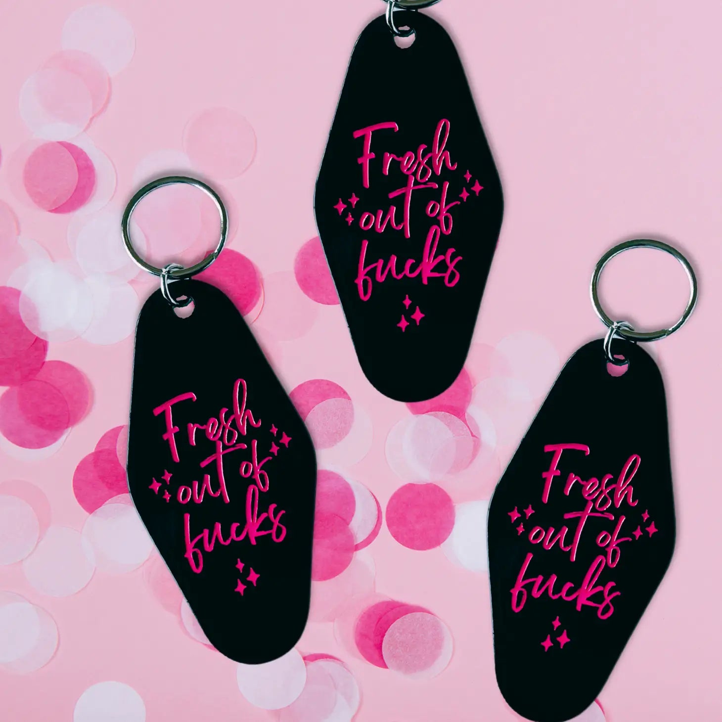 black keychain with hot pink text - fresh out of fucks