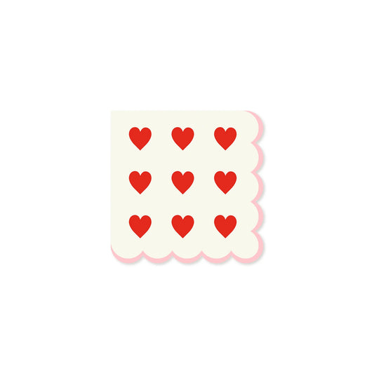 white napkins with scalloped edge and red heart designs