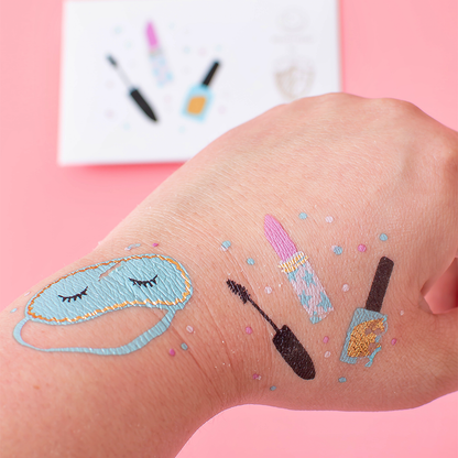slumber party themed temporary tattoos featuring and eye mask and makeup