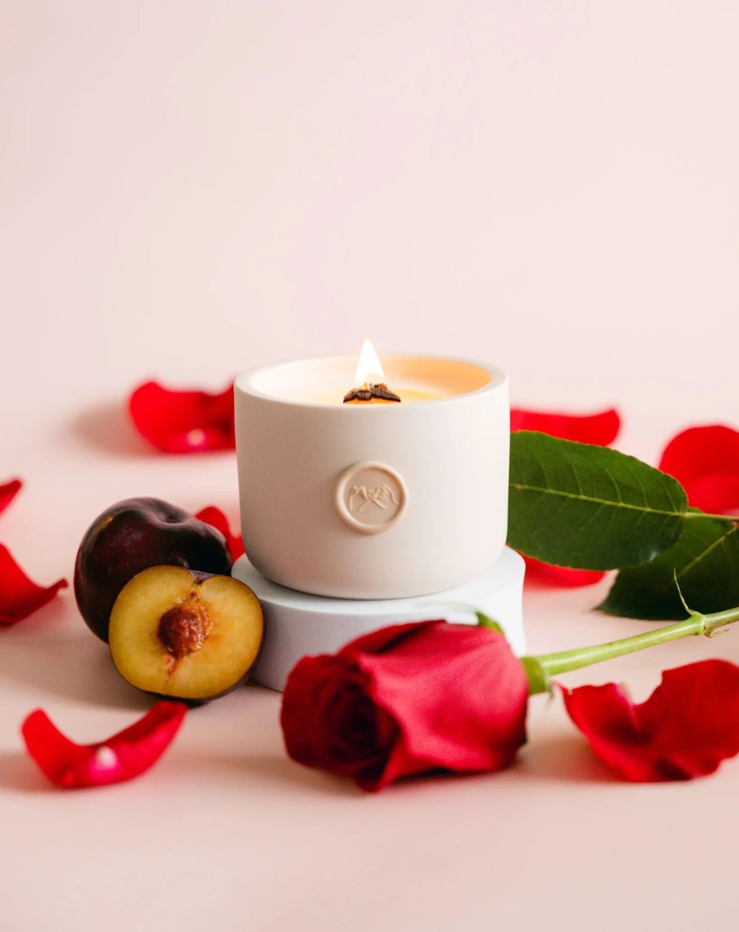 the romantic dark rose and plum scented candle by pinky swear & co.